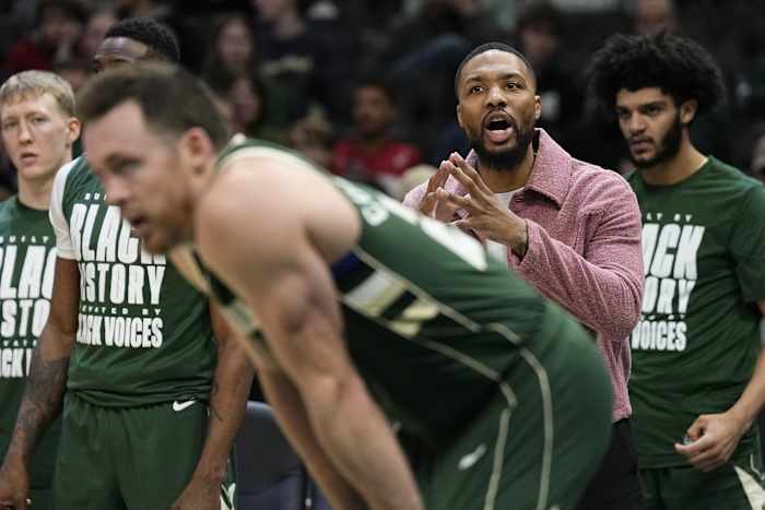 Milwaukee Bucks guard Damian Lillard calls out from the bench during the third quarter against the Minnesota Timberwolves